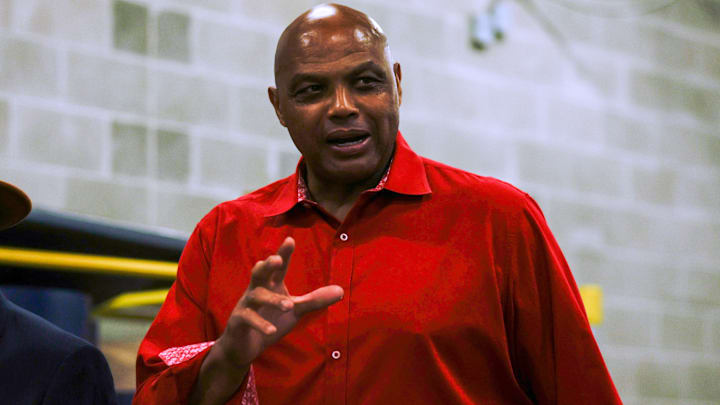 Hall of Famer Charles Barkley looks on.