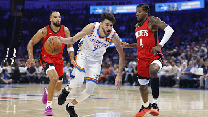 Oct 9, 2024; Oklahoma City, Oklahoma, USA; Oklahoma City Thunder forward Chet Holmgren (7) drives to the basket beside Houston Rockets guard Jalen Green (4) during the first quarter at Paycom Center. Mandatory Credit: Alonzo Adams-Imagn Images Oct 9, 2024; Oklahoma City, Oklahoma, USA; Oklahoma City Thunder forward Chet Holmgren (7) drives to the basket beside Houston Rockets guard Jalen Green (4) during the first quarter at Paycom Center. Mandatory Credit: Alonzo Adams-Imagn Images