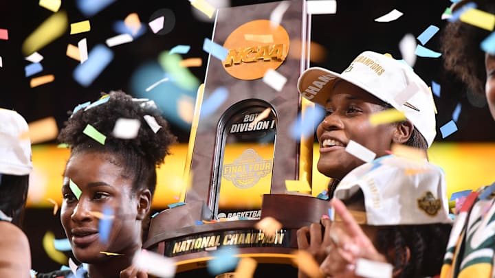 Apr 7, 2019; Tampa, FL, USA; Baylor Lady Bears center Kalani Brown (21) hoists the trophy after defeating the Notre Dame Fighting Irish to win the championship game of the women's Final Four of the 2019 NCAA Tournament at Amalie Arena. Mandatory Credit: Jasen Vinlove-Imagn Images