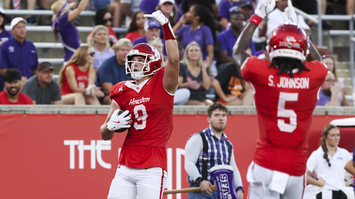 Aug 28, 2025; Houston, Texas, USA; Houston Cougars tight end Tanner Koziol (9) celebrates with wide receiver Stephon Johnson (5) after scoring a touchdown during the first quarter against the Stephen F. Austin Lumberjacks at TDECU Stadium. Mandatory Credit: Troy Taormina-Imagn Images Aug 28, 2025; Houston, Texas, USA; Houston Cougars tight end Tanner Koziol (9) celebrates with wide receiver Stephon Johnson (5) after scoring a touchdown during the first quarter against the Stephen F. Austin Lumberjacks at TDECU Stadium. Mandatory Credit: Troy Taormina-Imagn Images