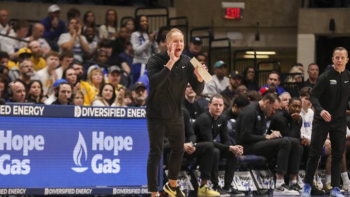 Feb 28, 2026; Morgantown, West Virginia, USA; BYU Cougars head coach Kevin Young yells from the sideline during the first half against the West Virginia Mountaineers at Hope Coliseum. Mandatory Credit: Ben Queen-Imagn Images