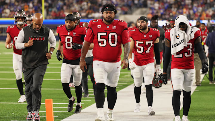 Nov 23, 2025; Inglewood, California, USA; Tampa Bay Buccaneers defensive tackle Vita Vea (50) walks off the field during halftime with linebacker SirVocea Dennis (8), linebacker John Bullock (57) and safety Tykee Smith (23) against the Los Angeles Rams at SoFi Stadium. Mandatory Credit: Kiyoshi Mio-Imagn Images