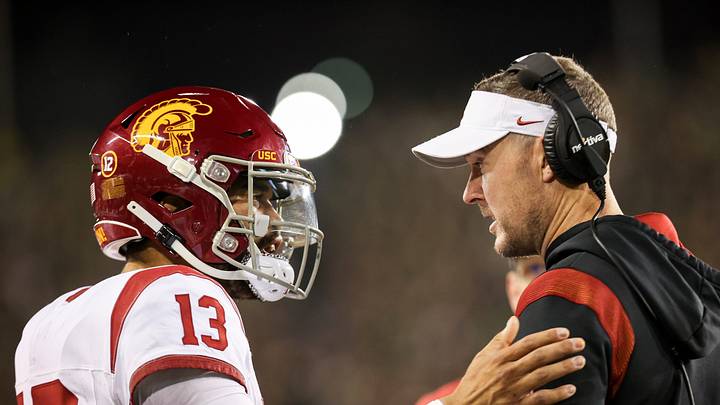 USC Trojans quarterback Caleb Williams (13) talks with USC Trojans head coach Lincoln Riley during the first half of the game against No. 6 Oregon Ducks on Saturday, Nov. 11, 2023, at Autzen Stadium in Eugene, Ore. USC Trojans quarterback Caleb Williams (13) talks with USC Trojans head coach Lincoln Riley during the first half of the game against No. 6 Oregon Ducks on Saturday, Nov. 11, 2023, at Autzen Stadium in Eugene, Ore.