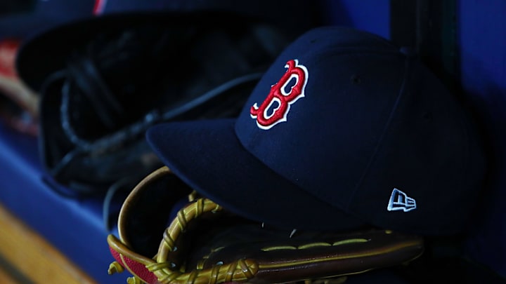 Jul 22, 2019; St. Petersburg, FL, USA; A detail view of Boston Red Sox hat and glove laying in the dugout at Tropicana Field. Mandatory Credit: Kim Klement-Imagn Images Jul 22, 2019; St. Petersburg, FL, USA; A detail view of Boston Red Sox hat and glove laying in the dugout at Tropicana Field. Mandatory Credit: Kim Klement-Imagn Images