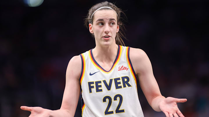May 22, 2025; Atlanta, Georgia, USA; Indiana Fever guard Caitlin Clark (22) talks to a referee against the Atlanta Dream in the first half at State Farm Arena. Mandatory Credit: Brett Davis-Imagn Images