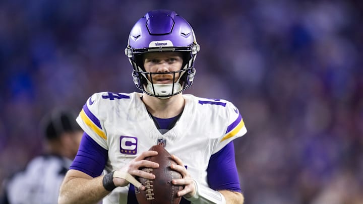 Jan 13, 2025; Glendale, AZ, USA; Minnesota Vikings quarterback Sam Darnold (14) against the Los Angeles Rams during an NFC wild card game at State Farm Stadium. Mandatory Credit: Mark J. Rebilas-Imagn Images