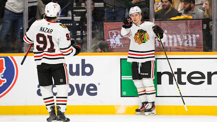Jan 16, 2025; Nashville, Tennessee, USA;  Chicago Blackhawks center Connor Bedard (98) celebrates his goal with center Frank Nazar (91) against the Nashville Predators during the second period at Bridgestone Arena. Mandatory Credit: Steve Roberts-Imagn Images