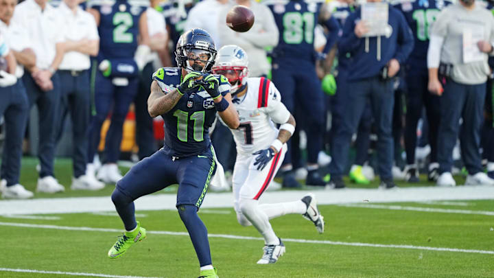 Seattle Seahawks wide receiver Jaxon Smith-Njigba makes a catch against New England Patriots cornerback Carlton Davis III.
