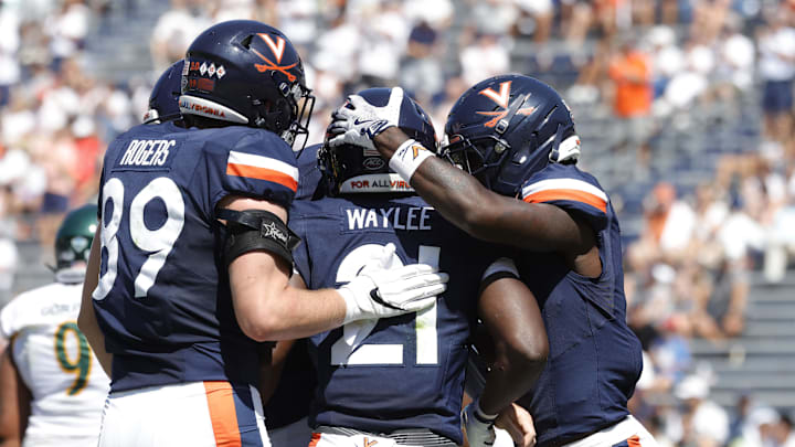 Sep 13, 2025; Charlottesville, Virginia, USA; Virginia Cavaliers running back Harrison Waylee (21) celebrates with teammates after scoring a touchdown against the William & Mary Tribe during the second quarter at Scott Stadium. Mandatory Credit: Amber Searls-Imagn Images Sep 13, 2025; Charlottesville, Virginia, USA; Virginia Cavaliers running back Harrison Waylee (21) celebrates with teammates after scoring a touchdown against the William & Mary Tribe during the second quarter at Scott Stadium. Mandatory Credit: Amber Searls-Imagn Images