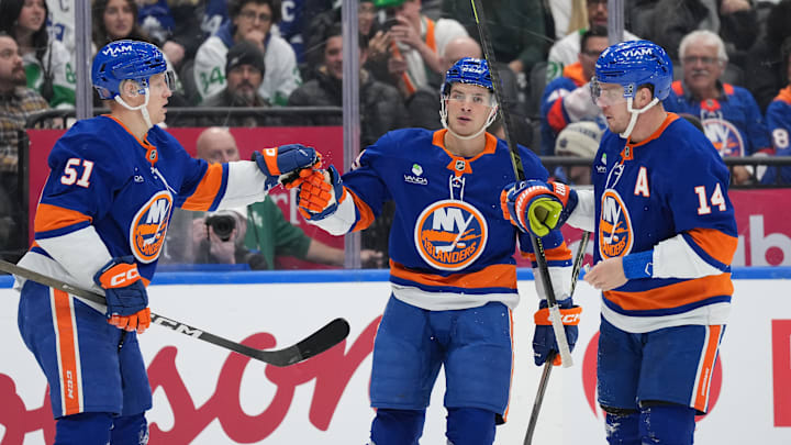 Mar 17, 2026; Toronto, Ontario, CAN; New York Islanders left wing Emil Heineman (51) scores a goal and celebrates with center Mathew Barzal (13) against the Toronto Maple Leafs during the second period at Scotiabank Arena. Mandatory Credit: Nick Turchiaro-Imagn Images