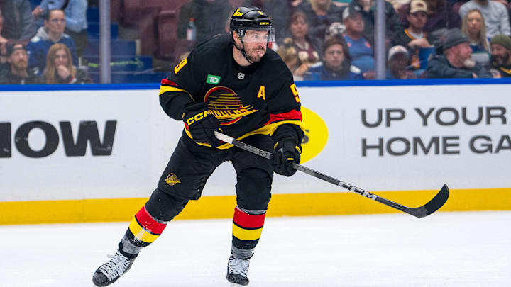 Nov 9, 2024; Vancouver, British Columbia, CAN; Vancouver Canucks forward J.T. Miller (9) makes a pass against the Edmonton Oilers during the third period at Rogers Arena. Mandatory Credit: Bob Frid-Imagn Images