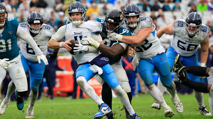 Jacksonville Jaguars defensive tackle Maason Smith (94) sacks Tennessee Titans quarterback Mason Rudolph (11) as Titans center Corey Levin (62) can’t help stop during the fourth quarter Sunday, Dec. 29, 2024 at EverBank Stadium in Jacksonville, Fla. The Jaguars held off the Titans 20-13. [Corey Perrine/Florida Times-Union]