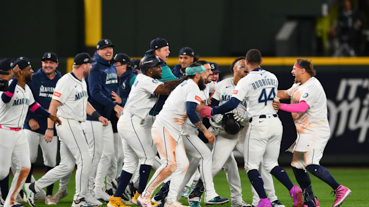 Oct 10, 2025; Seattle, Washington, USA; Seattle Mariners second baseman Jorge Polanco (7) is celebrated by teammates after a walk off single against the Detroit Tigers during the fifteenth inning during game five of the ALDS round for the 2025 MLB playoffs at T-Mobile Park. Oct 10, 2025; Seattle, Washington, USA; Seattle Mariners second baseman Jorge Polanco (7) is celebrated by teammates after a walk off single against the Detroit Tigers during the fifteenth inning during game five of the ALDS round for the 2025 MLB playoffs at T-Mobile Park.
