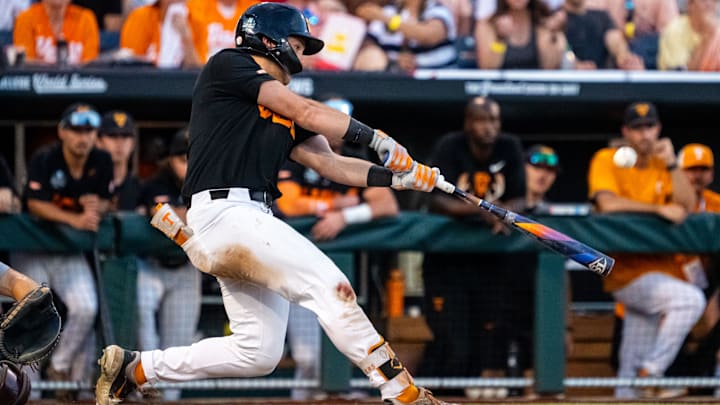 Jun 24, 2024; Omaha, NE, USA; Tennessee Volunteers left fielder Dylan Dreiling (8) hits a two-run home run against the Texas A&M Aggies during the seventh inning at Charles Schwab Field Omaha.