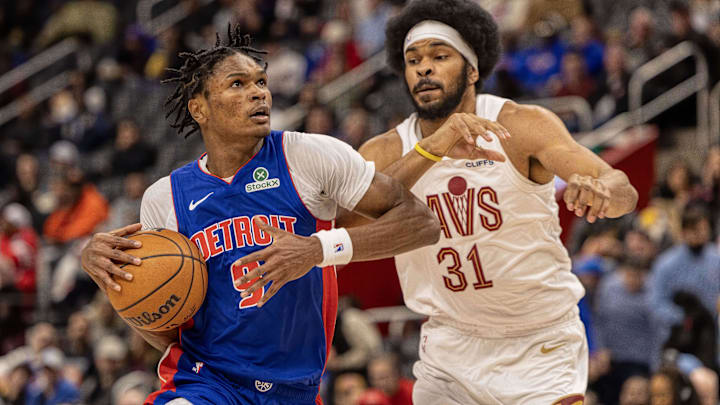 Feb 5, 2025; Detroit, Michigan, USA; Detroit Pistons forward Ausar Thompson (9) drives to the basket on Cleveland Cavaliers center Jarrett Allen (31) during the first half at Little Caesars Arena. Mandatory Credit: David Reginek-Imagn Images