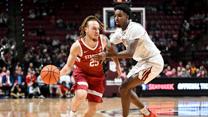 Jan 31, 2026; Tallahassee, Florida, USA; Stanford Cardinal guard Jeremy Dent-Smith (25) drives the ball to the net past Florida State Seminoles forward Chauncey Wiggins (7) during the first half at Donald L. Tucker Center. Mandatory Credit: Melina Myers-Imagn Images