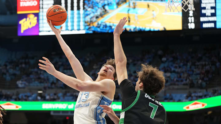 Dec 13, 2025; Chapel Hill, North Carolina, USA; North Carolina Tar Heels center Henri Veesaar (13) shoots as USC Upstate Spartans center Coen Collier (7) defends in the second half at Dean E. Smith Center. Mandatory Credit: Bob Donnan-Imagn Images Dec 13, 2025; Chapel Hill, North Carolina, USA; North Carolina Tar Heels center Henri Veesaar (13) shoots as USC Upstate Spartans center Coen Collier (7) defends in the second half at Dean E. Smith Center. Mandatory Credit: Bob Donnan-Imagn Images