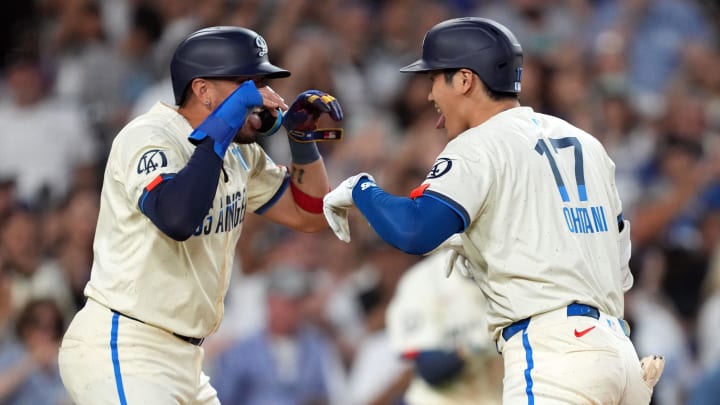 Aug 24, 2024; Los Angeles, California, USA; Los Angeles Dodgers designated hitter Shohei Ohtani (17) celebrates with shortstop Miguel Rojas (11) after hitting a two-run home run in the fifth inning against the Tampa Bay Rays at Dodger Stadium. Mandatory Credit: Kirby Lee-USA TODAY Sports Aug 24, 2024; Los Angeles, California, USA; Los Angeles Dodgers designated hitter Shohei Ohtani (17) celebrates with shortstop Miguel Rojas (11) after hitting a two-run home run in the fifth inning against the Tampa Bay Rays at Dodger Stadium. Mandatory Credit: Kirby Lee-USA TODAY Sports