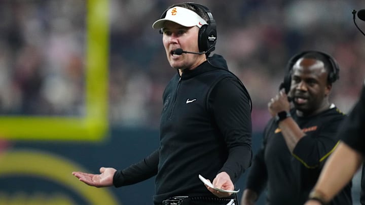 Dec 27, 2024; Las Vegas, NV, USA; Southern California Trojans head coach Lincoln Riley reacts against the Texas A&M Aggies in the first half at Allegiant Stadium. Mandatory Credit: Kirby Lee-Imagn Images
