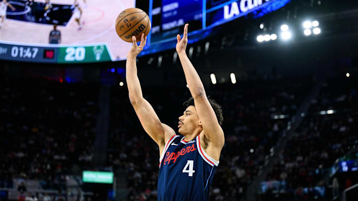 Mar 23, 2026; Inglewood, California, USA; Los Angeles Clippers guard Kobe Sanders (4) shoots the ball during the first half against the Milwaukee Bucks at Intuit Dome. Mandatory Credit: William Liang-Imagn Images