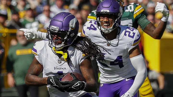 Sep 29, 2024; Green Bay, Wisconsin, USA;  Minnesota Vikings cornerback Shaquill Griffin (1) interceptions a pass against the Green Bay Packers at Lambeau Field. Mandatory Credit: Tork Mason/USA TODAY Network via Imagn Images