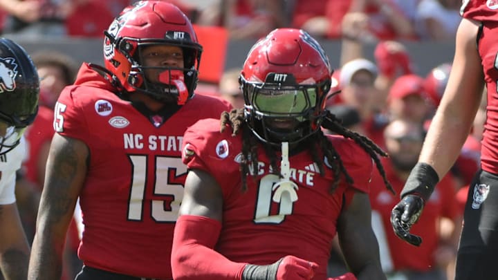 Sep 28, 2024; Raleigh, North Carolina, USA;  North Carolina State Wolfpack linebacker Sean Brown (0) celebrates after a tackle against the Northern Illinois Huskies at Carter-Finley Stadium. Mandatory Credit: Zachary Taft-Imagn Images