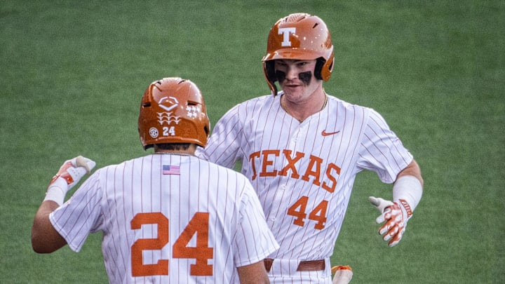 Texas infielder Adrian Rodriguez (24) welcomes outfielder Max Belyeu (44) back after scoring a run for Texas in the first inning of the Longhorns' game against the UTSA Roadrunners, March 18, 2025 at UFCU Disch-Falk Field in Austin.