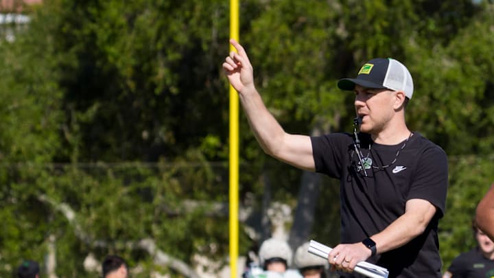 Oregon offensive coordinator Will Stein walks the field as the Oregon Ducks practice at Barry University ahead of the Orange Bowl on Dec. 30, 2025, in Miami, Florida.
