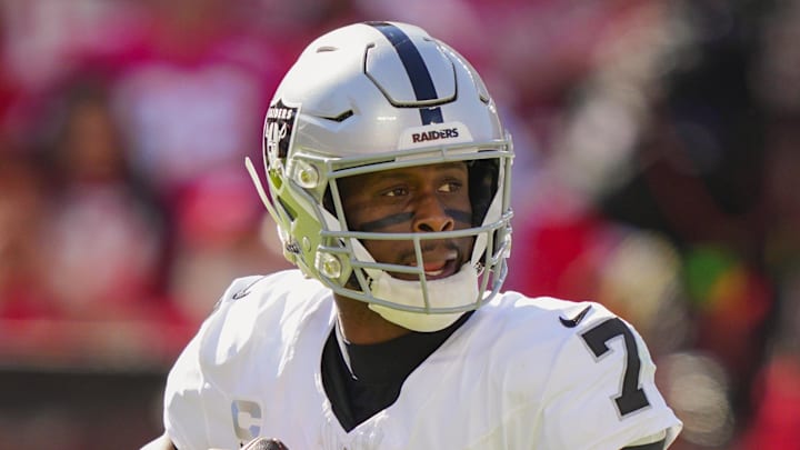 Oct 19, 2025; Kansas City, Missouri, USA; Las Vegas Raiders quarterback Geno Smith (7) drops back to pass during the second half against the Kansas City Chiefs at GEHA Field at Arrowhead Stadium. Mandatory Credit: Jay Biggerstaff-Imagn Images
