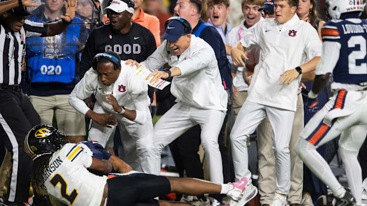 Auburn Tigers defensive coordinator DJ Durkin celebrates a Auburn Tigers defensive back Jay Crawford (23) interception as Auburn Tigers take on Missouri Tigers at Jordan-Hare Stadium in Auburn, Ala. on Saturday, Oct. 18, 2025. Missouri Tigers defeated the Auburn Tigers 23-17 in 2OT. Auburn Tigers defensive coordinator DJ Durkin celebrates a Auburn Tigers defensive back Jay Crawford (23) interception as Auburn Tigers take on Missouri Tigers at Jordan-Hare Stadium in Auburn, Ala. on Saturday, Oct. 18, 2025. Missouri Tigers defeated the Auburn Tigers 23-17 in 2OT.