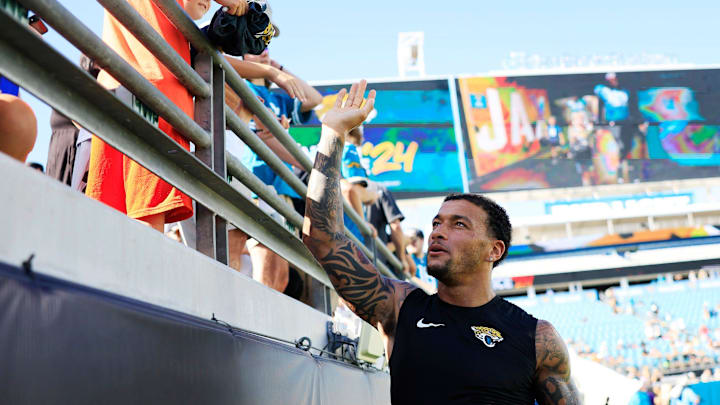 Jacksonville Jaguars tight end Evan Engram (17) greets fans during the ninth day of an NFL football training camp practice Saturday, Aug. 3, 2024 at EverBank Stadium in Jacksonville, Fla. Today marked the first day of public practice inside the stadium.