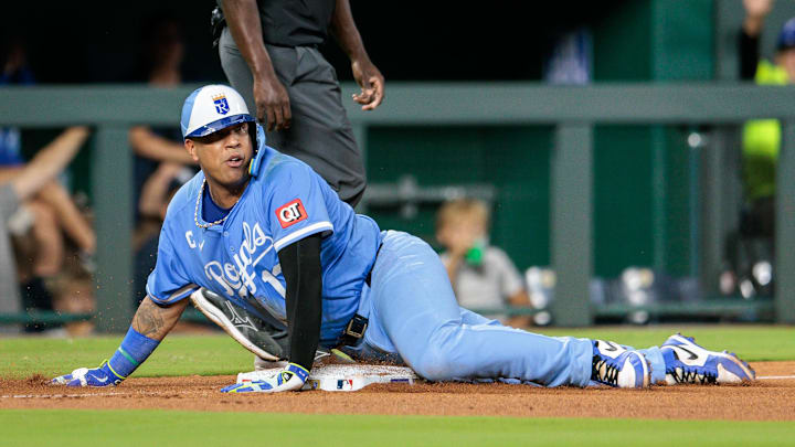 Sep 20, 2025; Kansas City, Missouri, USA; Kansas City Royals catcher Salvador Perez (13) slides into third base during the seventh inning against the Toronto Blue Jays at Kauffman Stadium. Mandatory Credit: William Purnell-Imagn Images