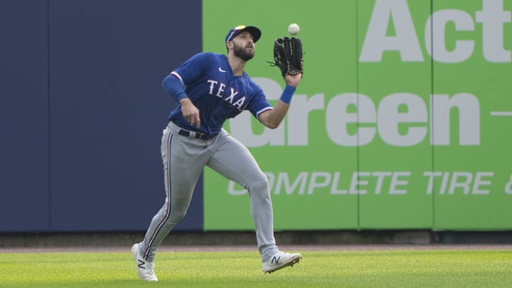 Buffalo, New York, USA; Texas Rangers right fielder Joey Gallo (13) catches a fly ball hit by Toronto Blue Jays first baseman Vladimir Guerrero Jr. (27) (not pictured) during the fourth inning at Sahlen Field.