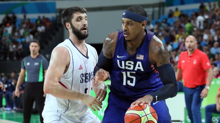 Aug 21, 2016; Rio de Janeiro, Brazil; USA forward Carmelo Anthony (15) handles the ball against Serbia small forward Marko Simonovic (5) in the men's basketball gold medal match during the Rio 2016 Summer Olympic Games at Carioca Arena 1. Mandatory Credit: David E. Klutho-USA TODAY Sports