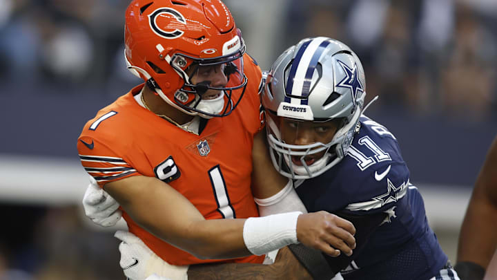 Micah Parsons lands a hit on former Bears QB Justin Fields in a 2022 game.