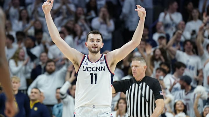 Mar 5, 2025; Storrs, Connecticut, USA; UConn Huskies forward Alex Karaban (11) reacts after his three point basket against the Marquette Golden Eagles in the second half at Harry A. Gampel Pavilion. Mandatory Credit: David Butler II-Imagn Images Mar 5, 2025; Storrs, Connecticut, USA; UConn Huskies forward Alex Karaban (11) reacts after his three point basket against the Marquette Golden Eagles in the second half at Harry A. Gampel Pavilion. Mandatory Credit: David Butler II-Imagn Images
