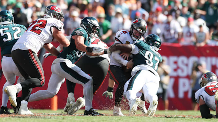 Sep 28, 2025; Tampa, Florida, USA; Tampa Bay Buccaneers quarterback Baker Mayfield (6) is tackled by Philadelphia Eagles defensive tackle Moro Ojomo (97) during the fourth quarter at Raymond James Stadium. Mandatory Credit: Nathan Ray Seebeck-Imagn Images Sep 28, 2025; Tampa, Florida, USA; Tampa Bay Buccaneers quarterback Baker Mayfield (6) is tackled by Philadelphia Eagles defensive tackle Moro Ojomo (97) during the fourth quarter at Raymond James Stadium. Mandatory Credit: Nathan Ray Seebeck-Imagn Images