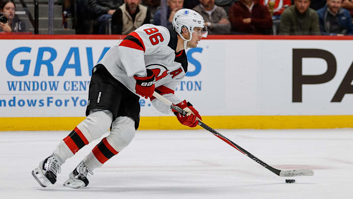 Oct 28, 2025; Denver, Colorado, USA; New Jersey Devils center Jack Hughes (86) controls the puck in the second period against the Colorado Avalanche at Ball Arena. Mandatory Credit: Isaiah J. Downing-Imagn Images