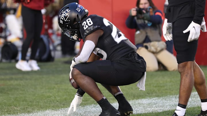 Nov 26, 2021; Ames, Iowa, USA; Iowa State Cyclones running back Breece Hall (28) scores a touchdown against the TCU Horned Frogs at Jack Trice Stadium. Hall scored in his 24th straight football game to break the school   s all time record. Mandatory Credit: Reese Strickland-Imagn Images