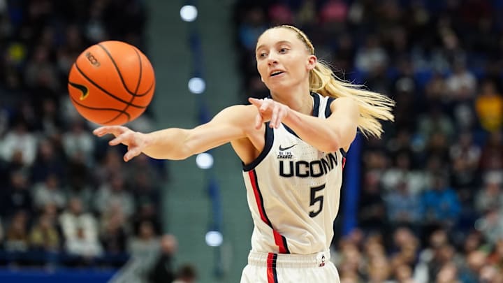 Dec 15, 2024; Storrs, Connecticut, USA; UConn Huskies guard Paige Bueckers (5) passes the ball against the Georgetown Hoyas in the first half at XL Center. Mandatory Credit: David Butler II-Imagn Images
