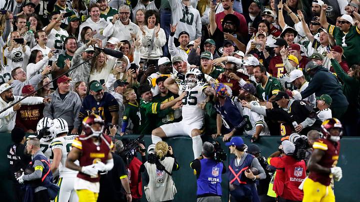 Green Bay Packers fans cheer after tight end Tucker Kraft does a Lambeau Leap during a game against the Washington Commanders on Sept. 11, 2025, at Lambeau Field in Green Bay, Wis. The Packers defeated the Commanders 27-18.