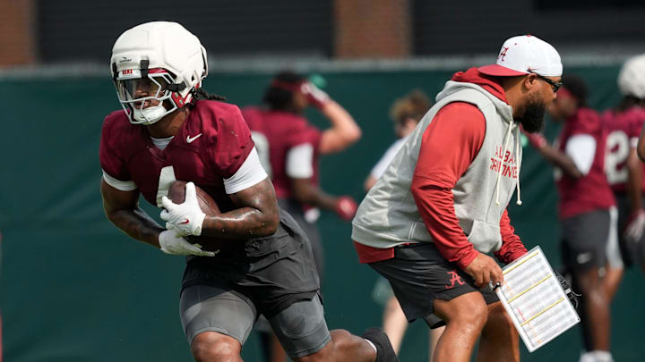 July 30, 2025; Tuscaloosa, AL, USA; Running back Daniel Hill makes a cut around running backs coach Robert Gillespie during the first practice session of the preseason for the Alabama Crimson Tide. July 30, 2025; Tuscaloosa, AL, USA; Running back Daniel Hill makes a cut around running backs coach Robert Gillespie during the first practice session of the preseason for the Alabama Crimson Tide.