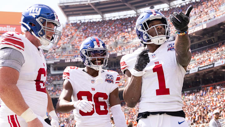 Sep 22, 2024; Cleveland, Ohio, USA; New York Giants wide receiver Malik Nabers (1) celebrates his touchdown with teammates against the Cleveland Browns during the second quarter at Huntington Bank Field. Mandatory Credit: Scott Galvin-Imagn Images