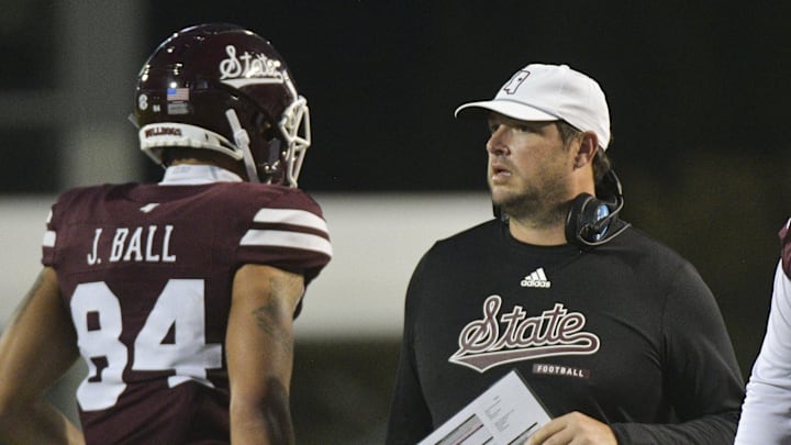 Nov 2, 2024; Starkville, Mississippi, USA; Mississippi State Bulldogs head coach Jeff Lebby speaks with players during the fourth quarter against the Massachusetts Minutemen at Davis Wade Stadium at Scott Field. Mandatory Credit: Matt Bush-Imagn Images