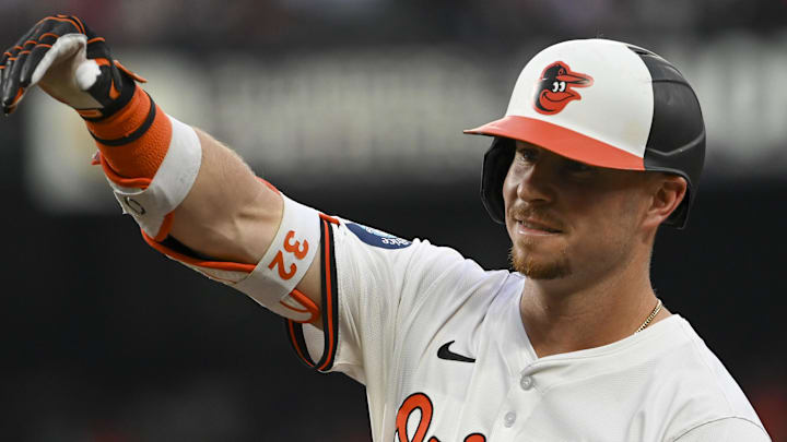 Jul 30, 2024; Baltimore, Maryland, USA;  Baltimore Orioles first base Ryan O'Hearn (32) reacts after hitting a two run single against the Toronto Blue Jays in the third inning at Oriole Park at Camden Yards. Mandatory Credit: Tommy Gilligan-Imagn Images