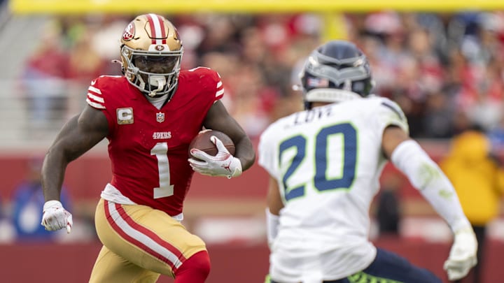 November 17, 2024; Santa Clara, California, USA; San Francisco 49ers wide receiver Deebo Samuel Sr. (1) runs the football against Seattle Seahawks safety Julian Love (20) during the fourth quarter at Levi's Stadium. Mandatory Credit: Kyle Terada-Imagn Images November 17, 2024; Santa Clara, California, USA; San Francisco 49ers wide receiver Deebo Samuel Sr. (1) runs the football against Seattle Seahawks safety Julian Love (20) during the fourth quarter at Levi's Stadium. Mandatory Credit: Kyle Terada-Imagn Images