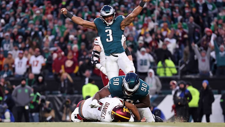 Jan 26, 2025; Philadelphia, PA, USA; Philadelphia Eagles linebacker Nolan Smith Jr. (3) celebrates as defensive tackle Jordan Davis (90) sacks Washington Commanders quarterback Jayden Daniels (5) during the second half in the NFC Championship game at Lincoln Financial Field. Mandatory Credit: Bill Streicher-Imagn Images