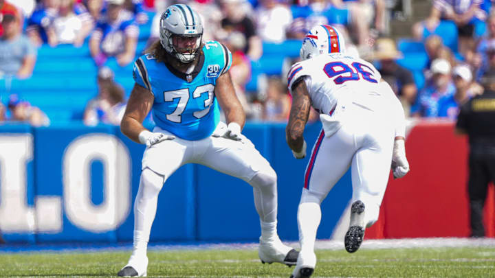 Aug 24, 2024; Orchard Park, New York, USA; Carolina Panthers offensive tackle Tyler Smith gets in position to block Buffalo Bills defensive end Kameron Cline (96) during the second half at Highmark Stadium.