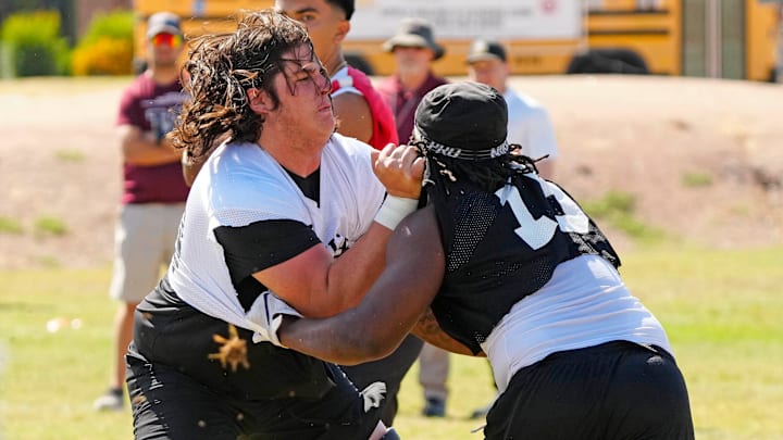 Hamilton tackle Rex Waterman (73) blocks defensive end Ben Jones (79) during practice at Hamilton High School at the Chandler Unified School District Spring Football Jamboree on May 14, 2024, in Chandler.