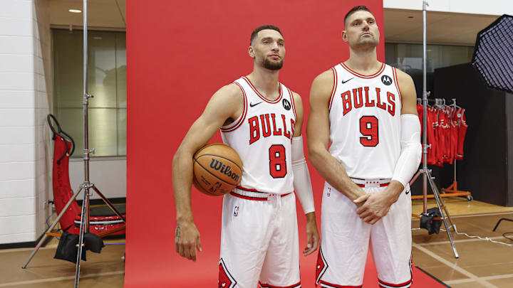 Chicago Bulls guard Zach LaVine (8) and center Nikola Vucevic (9) pose during Chicago Bulls Media Day. Mandatory Credit: Kamil Krzaczynski-Imagn Images